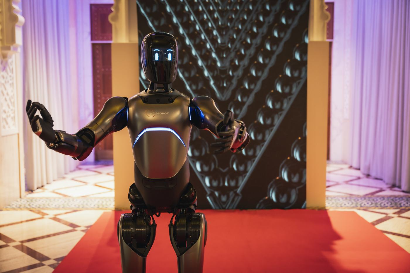 Mangobot A2 Ultra greeting guests at a red carpet event